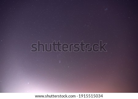 Stars Sirius near the constellation Orion in the  night sky.