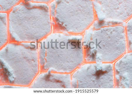 abstraction fire through the snow, cracks in the snow, flour macro