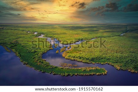 Aerial View of Florida Everglades Golden Hour Sunset Royalty-Free Stock Photo #1915570162