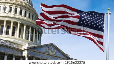 American flag waving with the US Capitol Hill in the background Royalty-Free Stock Photo #1915633375