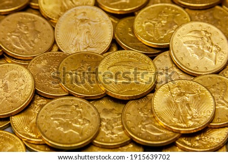 American gold coin treasure hoard of the rare USA double eagle 20 dollar bullion currency coinage used in the late 19th century as America money, stock photo image Royalty-Free Stock Photo #1915639702