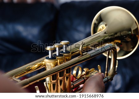 Trumpet. Close up of a trumpet, blurred background   Royalty-Free Stock Photo #1915668976