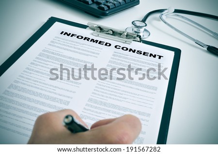 patient signing an informed consent in a doctors office Royalty-Free Stock Photo #191567282