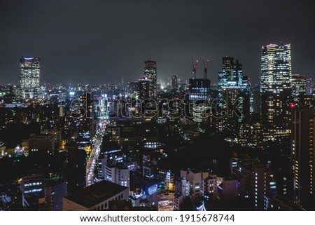 Panoramic view of Tokyo skyline, traffic and light by night from Tokyo Tower Observation Deck, Japan	
