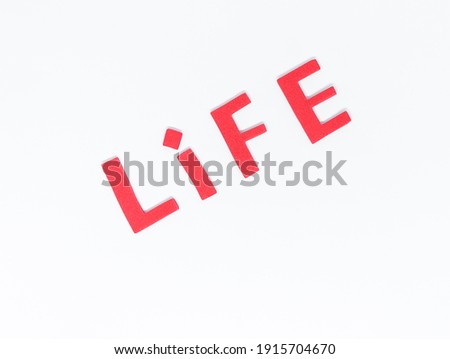 Red LIFE Letters On White Background