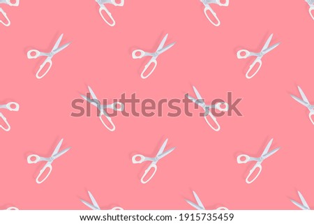 Scissors seamless pattern. Barber scissors on a red background. 