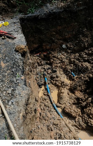 laborers are repairing piping systems, underground pipe leaks . Selective focus , close up