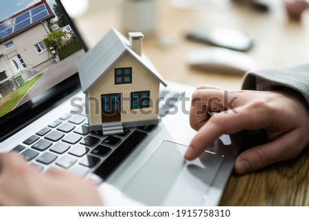 Online Real Estate House Property Sell Using Technology Royalty-Free Stock Photo #1915758310