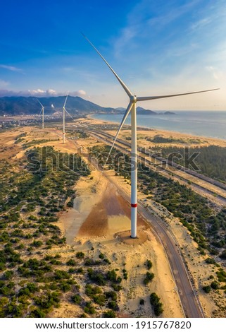 Windmills generate electricity in a fields. Phuong Mai peninsula, Quy Nhon city, Binh Dinh, Vietnam