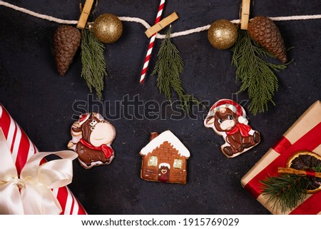 new year and christmas background, gift boxes, gingerbread, christmas toys, black texture background