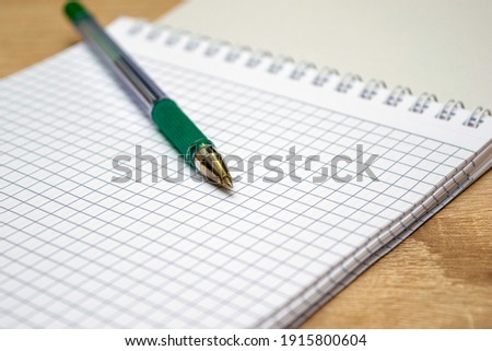 a fountain pen is lying on the open notebook. High quality photo