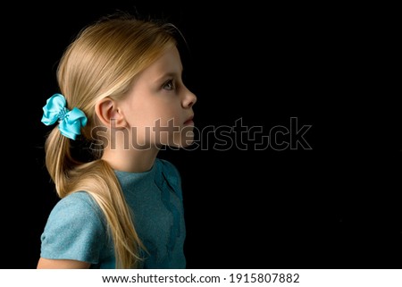 Profile portrait adorable blonde girl