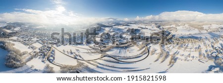 Panorama picture of town Grafenau and village Grueb in Bavarian forest with mountains landscape in winter with snow and ice, Germany