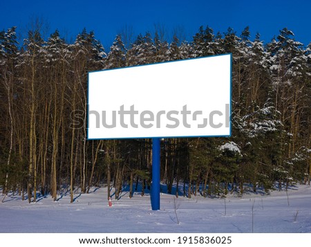 Background for design. Advertising billboard along the road in the city on a winter sunny day