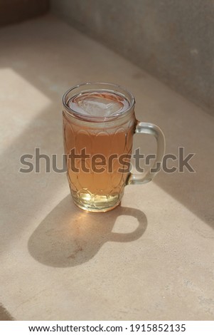 Photo of a cup of sweet iced tea looking so fresh during the day - A refreshing drink in summer