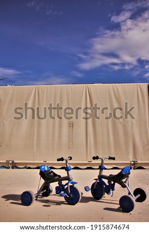 kids bicycles under the blue sky