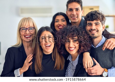 Group of business workers smiling happy and confident. Posing together with smile on face looking at the camera at the office