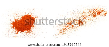 Set of red pepper paprika powder isolated on white background, top view. Heap of red pepper powder on a white background. Cayenne pepper powder, top view. Heap of red powder isolated on white. Royalty-Free Stock Photo #1915912744