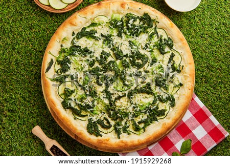 Spinach pizza for vegetarians. Healthy nutrition vegan lifestyle. Modern italian cuisine