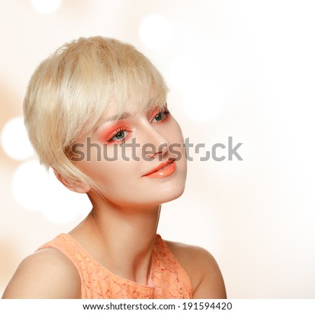 Natural Beauty model girl face closeup with creative make-up. Clean skin, skincare concept. Portrait of Beautiful Young Blonde Woman.