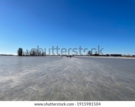 People ice skating on a frozen lake around Sneek in Friesland The Netherlands