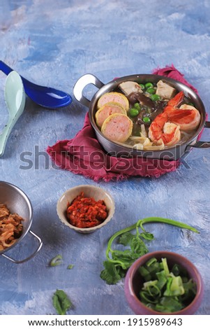 Selected Focus Jepara Wonton Soup or Sup Pangsit Jepara, Homemade Soup Made from Shrimp Stock and Shrimp and Chicken Rolade, Black Fungus, and Dried Tuberose. Popular as Sop Kartini