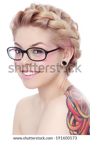 Portrait of young beautiful smiling freaky girl in glasses over white background