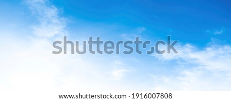 Air clouds in the blue sky.blue backdrop in the air. abstract style for text, design, fashion, agencies, websites, bloggers, publications, online marketers, brand, pattern, model, animation, Royalty-Free Stock Photo #1916007808
