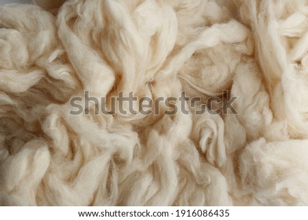 Soft white wool texture as background, closeup Royalty-Free Stock Photo #1916086435