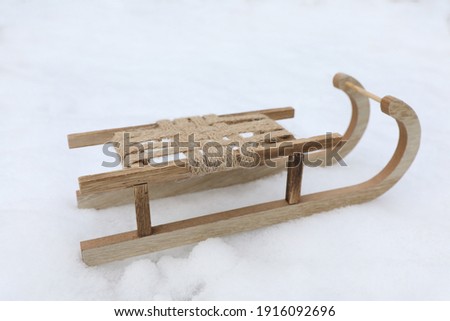 Wooden sleigh on snow outdoors. Winter activity
