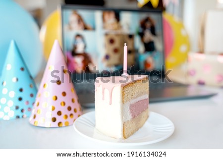Kids virtual birthday,home party.Piece of cake with candle.Online conference,video call in laptop,computer.Friends on screen,greetings.Decoration, gifts,balloons,flags,caps.Children celebrate holiday. Royalty-Free Stock Photo #1916134024