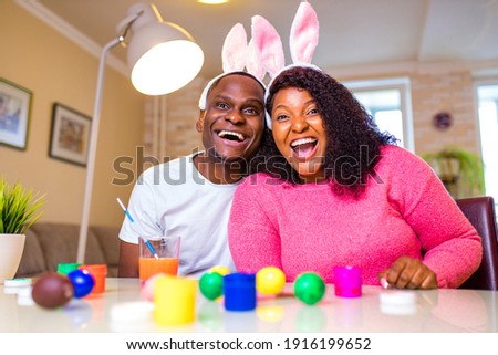 african american man preparing for Easter in apartment