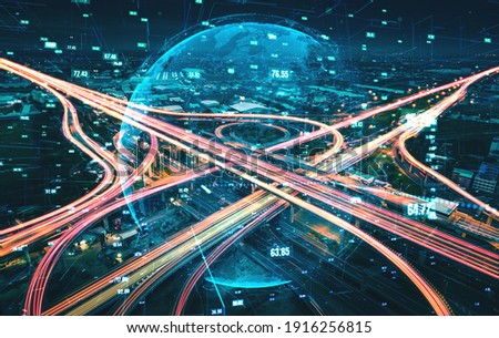 Futuristic road transportation technology with digital data transfer graphic showing concept of traffic big data analytic and internet of things . Royalty-Free Stock Photo #1916256815