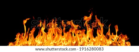 Fire flames on black background Royalty-Free Stock Photo #1916280083