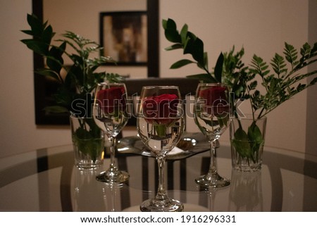 Picture of roses floating in a wine glass - Romantic Valentine's Day celebration