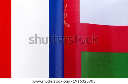 fragments of the national flags of France and Oman close-up