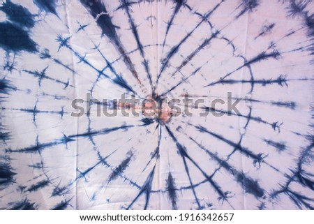 abstract background of colorful tie dyed shibori fabric with crumpled creases
