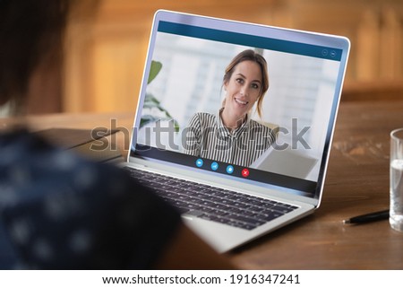 Close up businesswoman making video call, discussing project with colleague online, using laptop and webcam, student watching webinar or training, manager involved in conference, consulting client Royalty-Free Stock Photo #1916347241