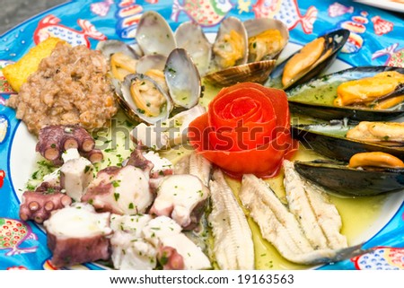 Close-up picture of a dish of mix seafood appetizer.