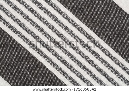 Black and white kitchen towel texture as a background, horizontal picture.