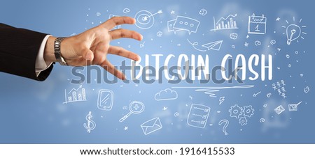 Close-Up of cropped hand pointing at BITCOIN CASH inscription, modern business solution concept