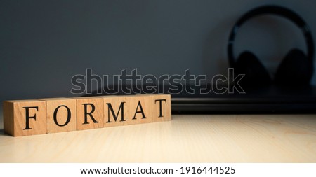 the word format is made up of square wooden cubes with letters .