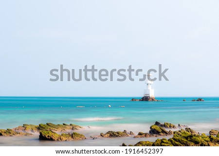 Lighthouse at the blue sea 