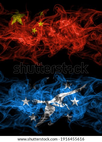 China, Chinese vs United States of America, America, US, USA, American, Corpus Christi, Texas smoky mystic flags placed side by side. Thick colored silky abstract smoke flags.
