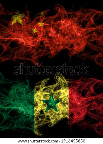 China, Chinese vs Senegal smoky mystic flags placed side by side. Thick colored silky abstract smoke flags.