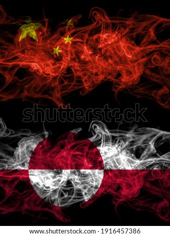 China, Chinese vs Greenland, Denmark, Danish smoky mystic flags placed side by side. Thick colored silky abstract smoke flags.