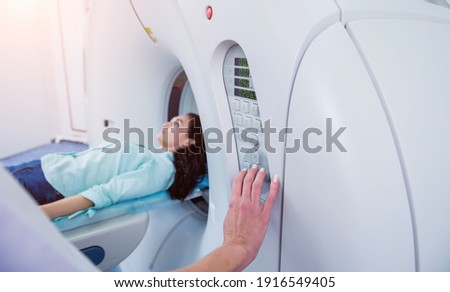 Doctor and patient in the room of computed tomography at hospital Royalty-Free Stock Photo #1916549405