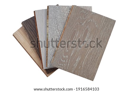 engineered hardwood or laminate flooring swatch samples in various type of wood texture, isolated on white background with clipping path. interior wooden flooring  swatch use for material board. Royalty-Free Stock Photo #1916584103