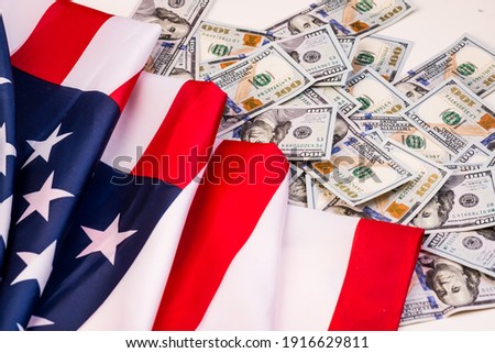 United States of America waving flag with many folds 100 dollar bills  ,joe biden 2021 Royalty-Free Stock Photo #1916629811