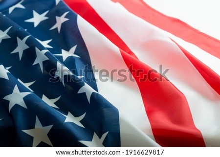 United States of America waving flag with many folds 100 dollar bills  ,joe biden 2021 US midterm election results 2022 Royalty-Free Stock Photo #1916629817